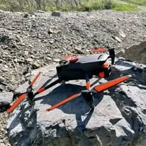 Search drone staged on rocky ground